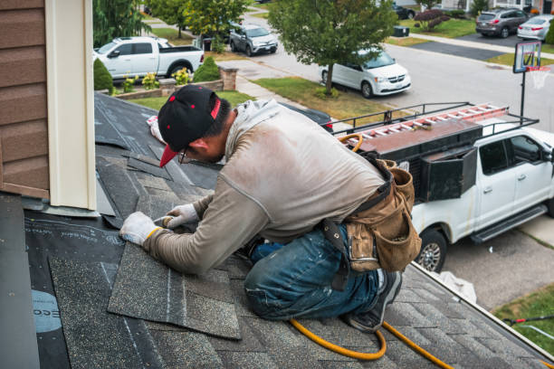 Professional Hail Damage Roof Repair technician working in East Glastonbury, CT